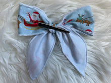 Load image into Gallery viewer, Blue Santa on a Sleigh Fable Hair Bow
